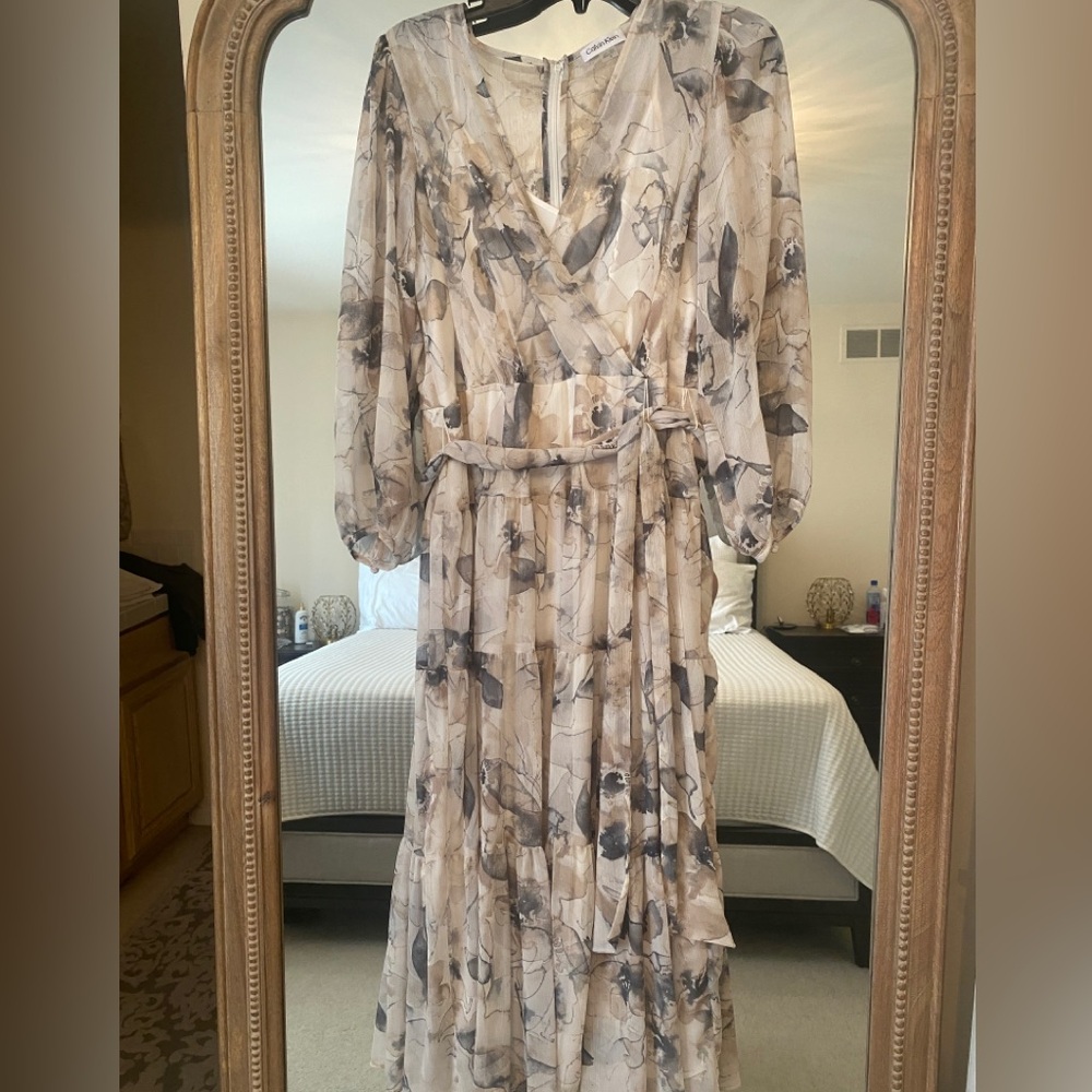 Calvin Klein tiered skirt sheer chiffon dress with long sleeves.  Size 12